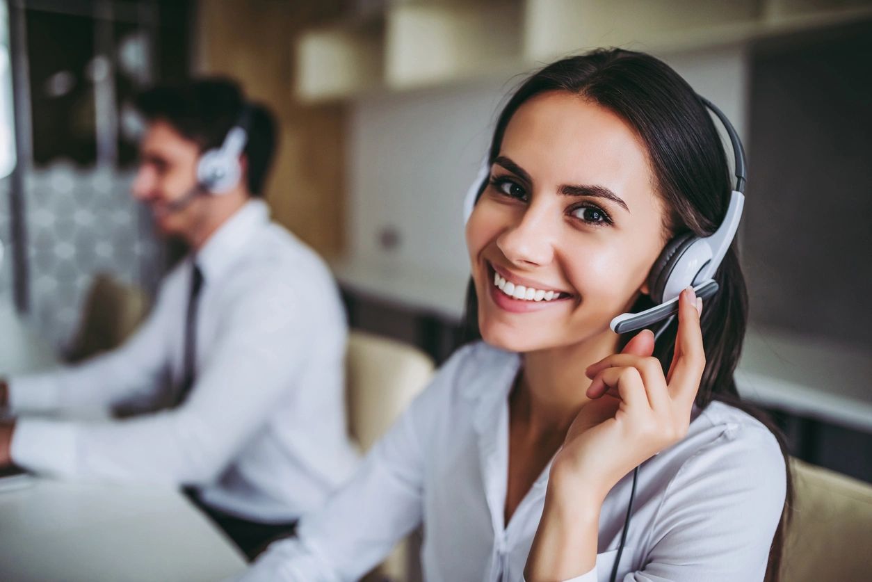 A woman wearing a headset